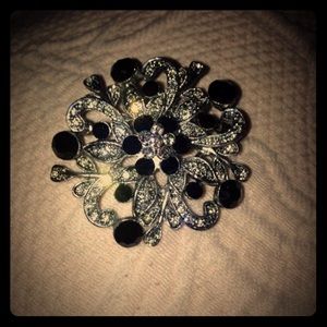 Black and clear rhinestone brooch